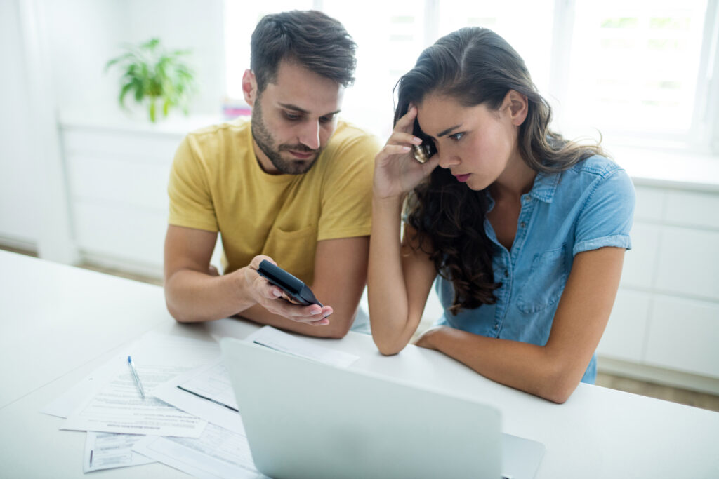 Young couple worries from money mistakes and feels shame from their debt